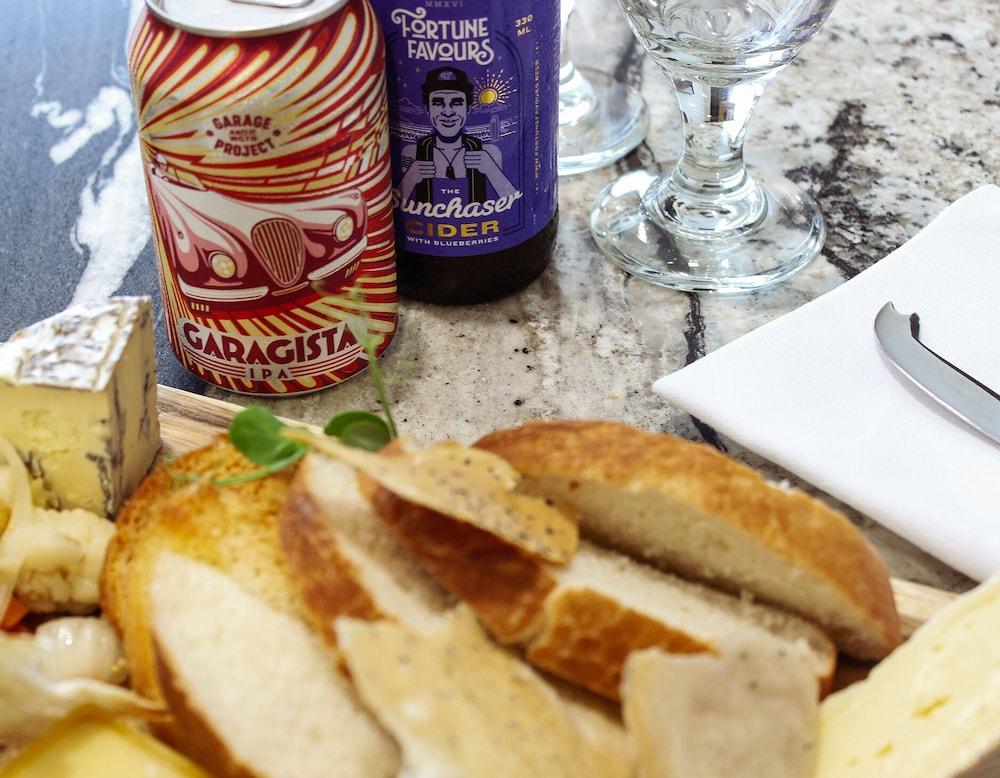Bolton Hotel Wellington Bagian luar foto A cheese board with a can of Carachia